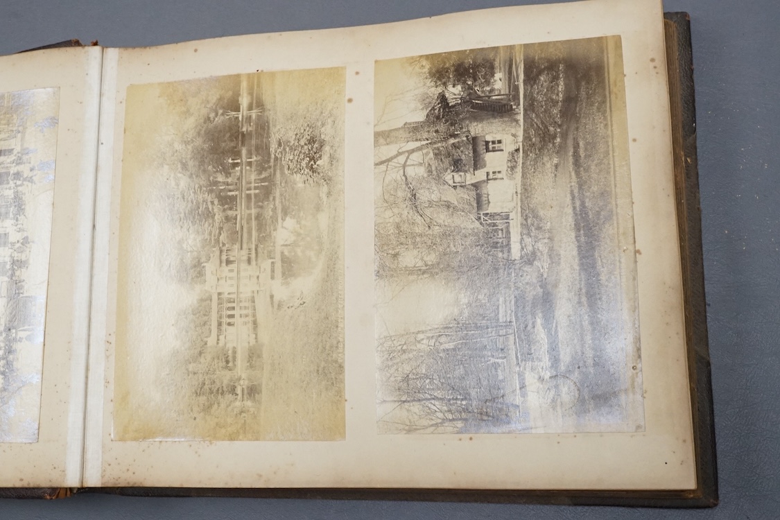 An early 20th century Photograph album of European views and a group of watches